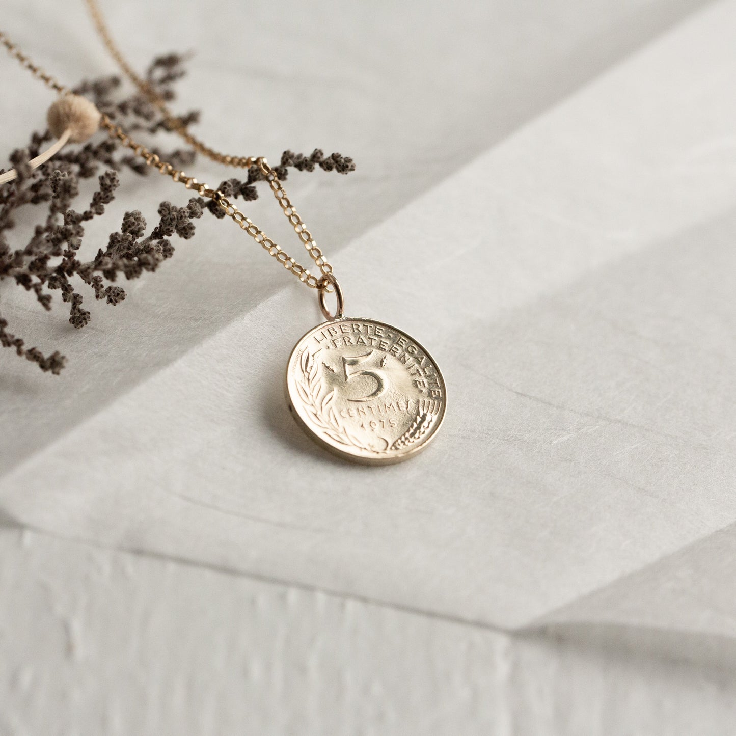 Tiny gold French coin