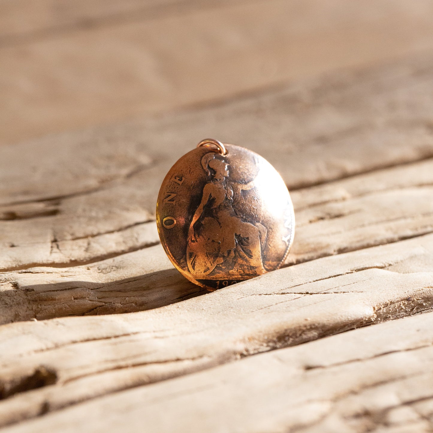 Queen Victoria penny charm.