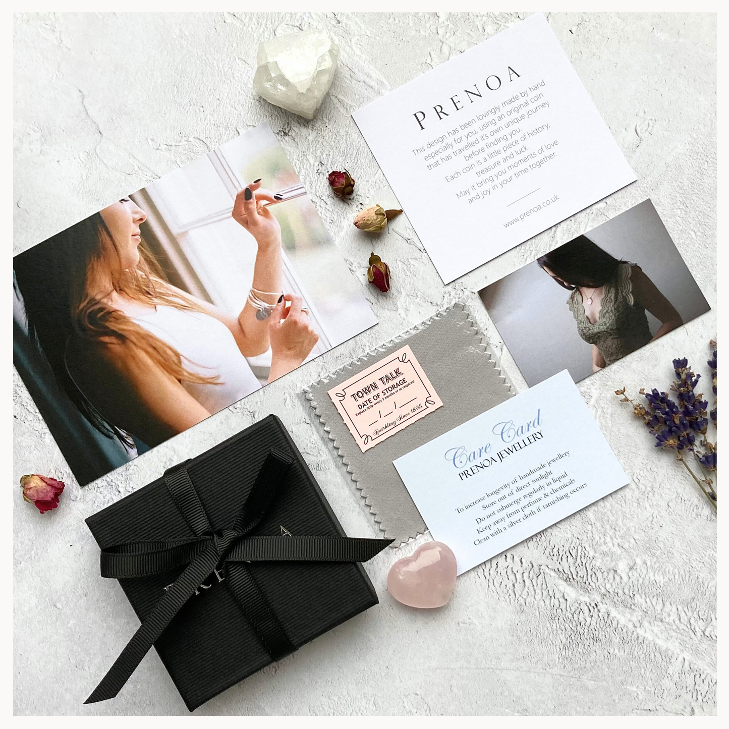 A bespoke necklace displayed alongside its packaging and a dated coin, indicating its luxury and custom-made nature.