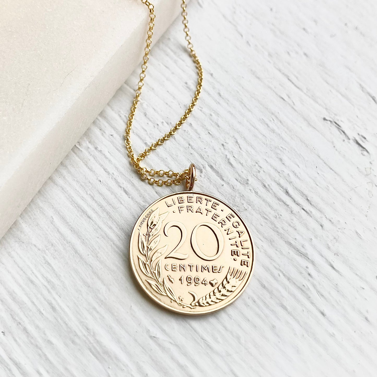 side view of 20 centimes French gold coin necklace