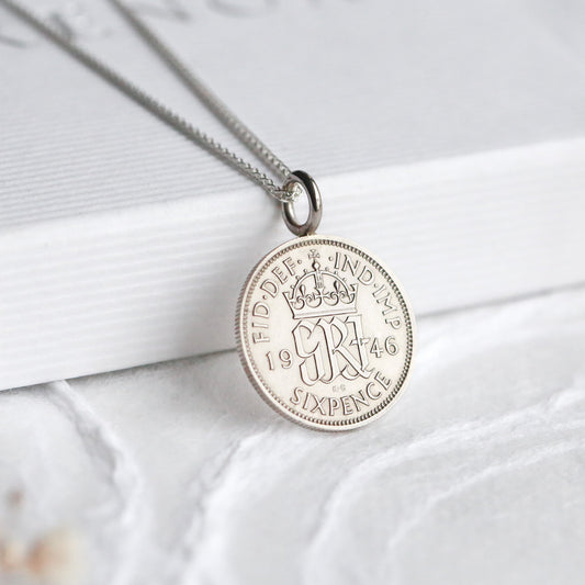 1946 British sixpence silver coin necklace, with a white background
