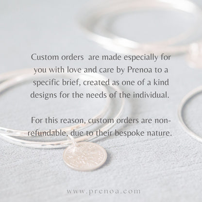 An image of a bronze coin pendant with a rose gold bail and solder, and a 9ct white gold rolo chain, accompanied by text describing the custom order policy.