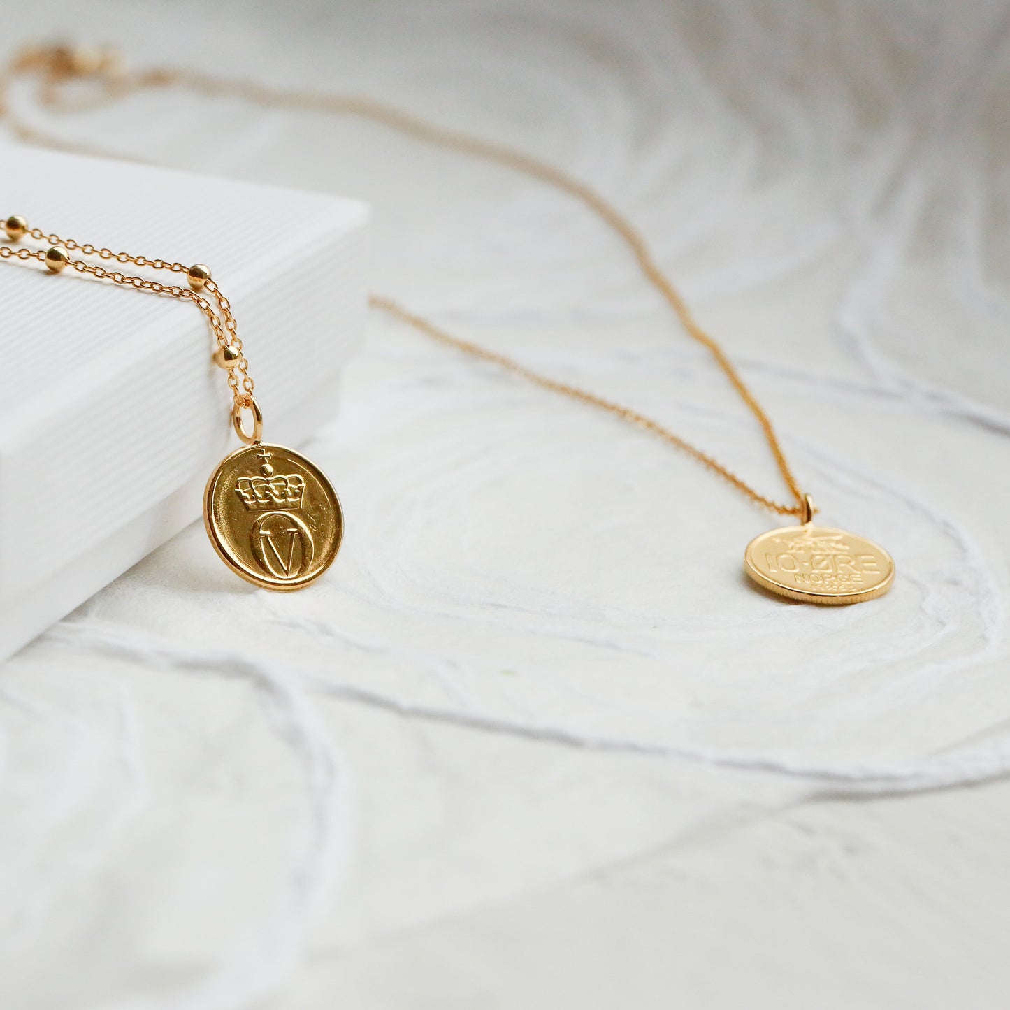 Gold bee coin necklaces using a real 10Ore Norway coin and plated in 22ct gold on a satellite chain or gold vermeil chain.