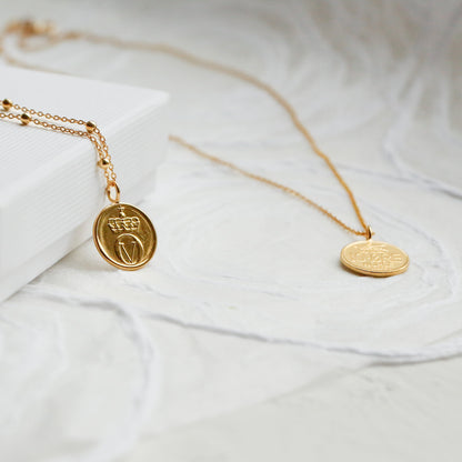 Gold bee coin necklaces using a real 10Ore Norway coin and plated in 22ct gold on a satellite chain or gold vermeil chain.