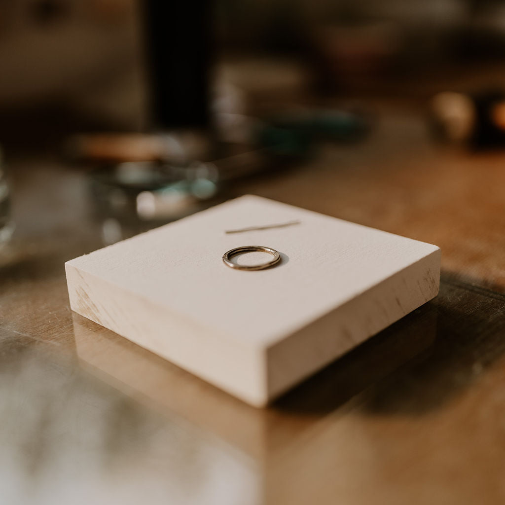 Ring on a white stone box with a blurred background