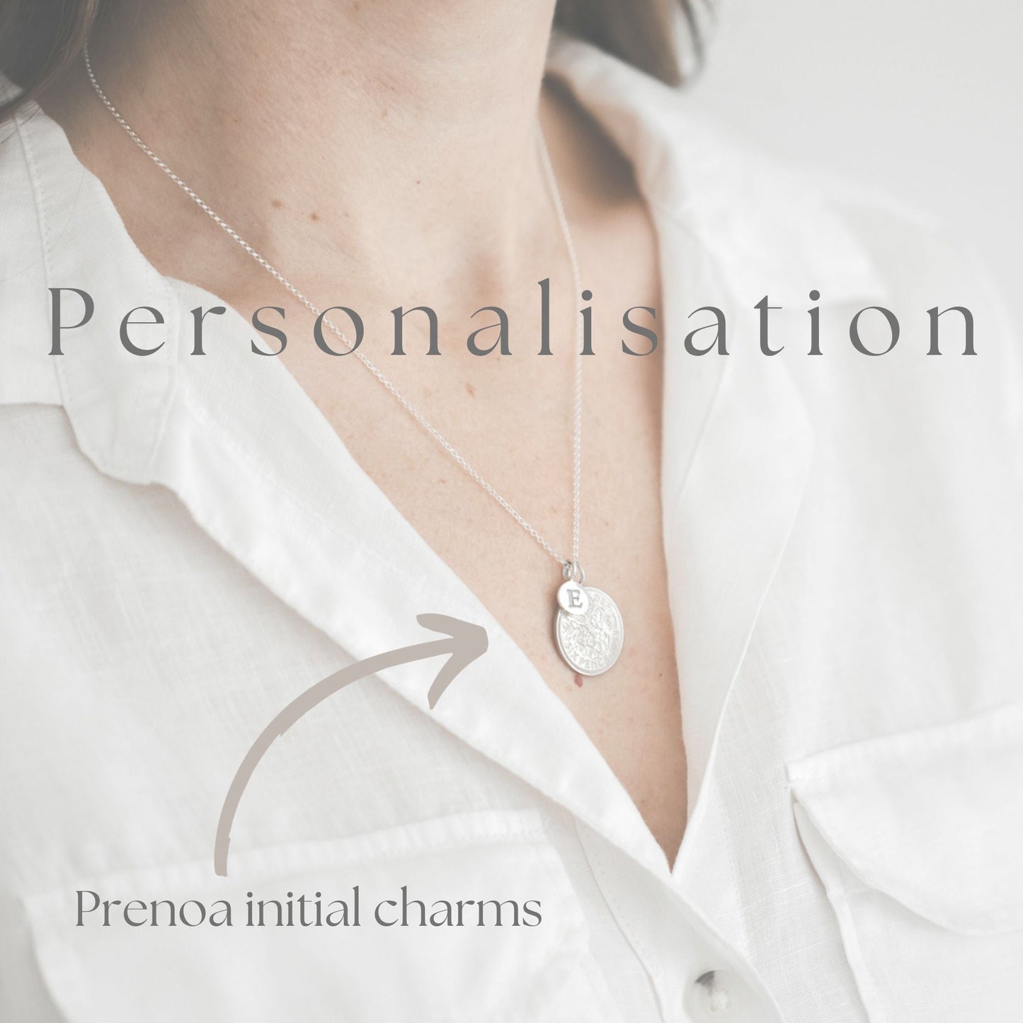 A sterling silver initial charm personalises your necklace