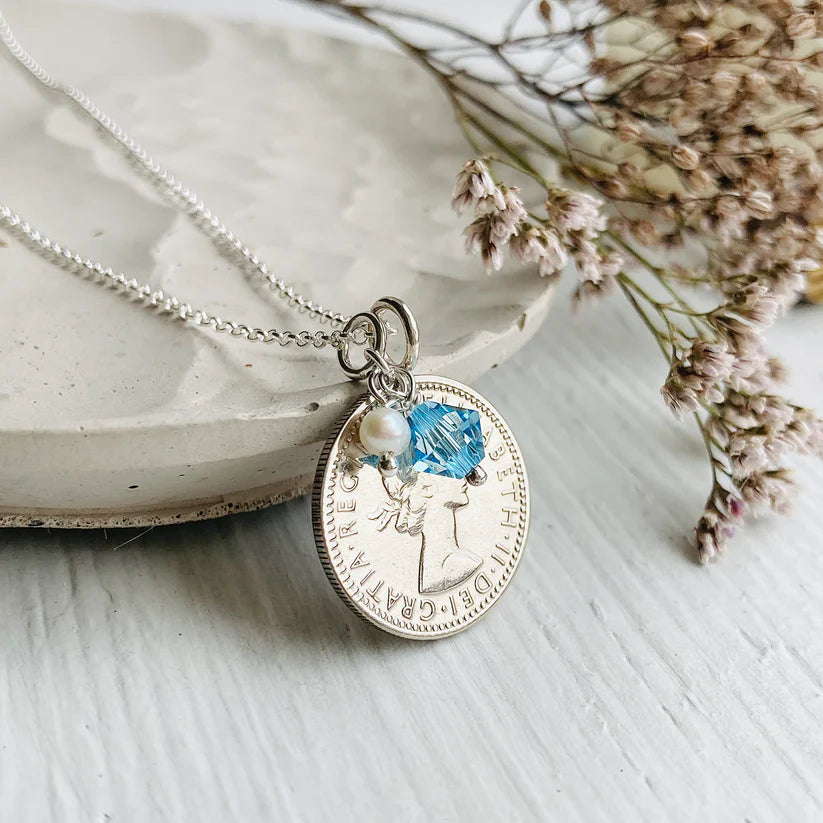 Silver British coin gifts for Women's 70th birthdays, with aquamarine charm and sterling silver chain
