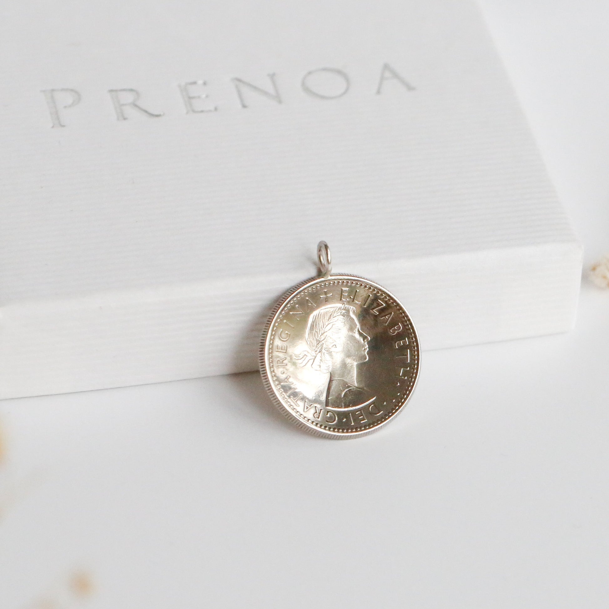 1966 domed QEII English shilling silver coin pendant on a white Prenoa background