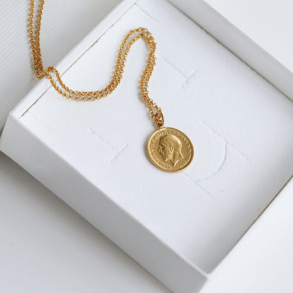 A gold coin necklace, real British coin with a gold chain, plated in 22carat gold. 