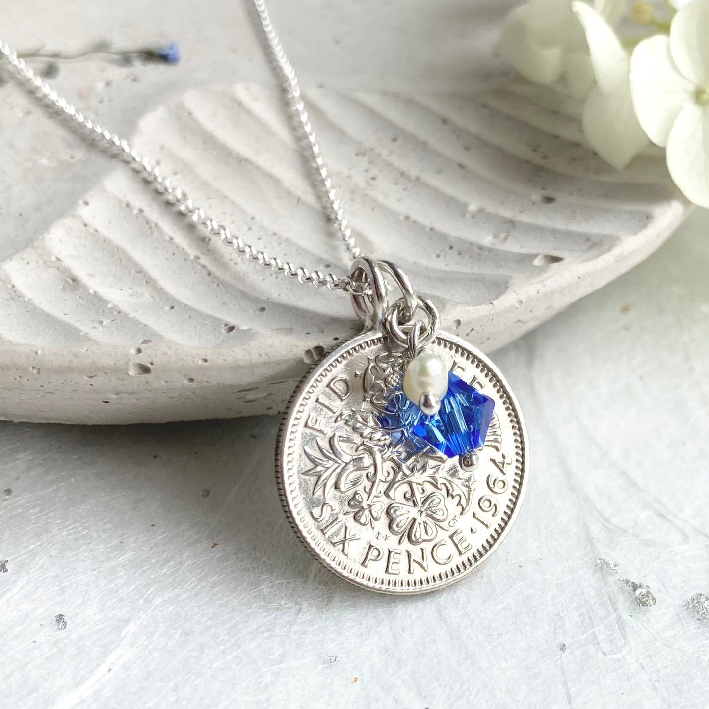 Front view, 60th sixpence silver coin necklace with sapphire charm and 925 chain