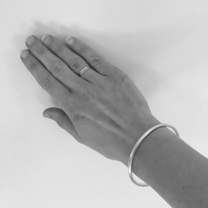 The bangle has passed over the knuckles in this photo and is a perfect fit. 
